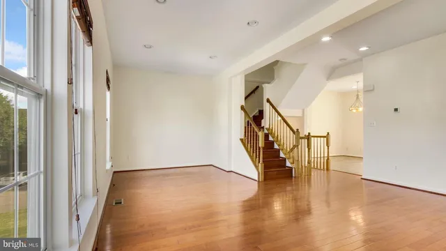 a view of an entryway with wooden floor
