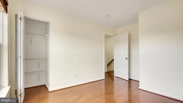 a view of an empty room and wooden floor