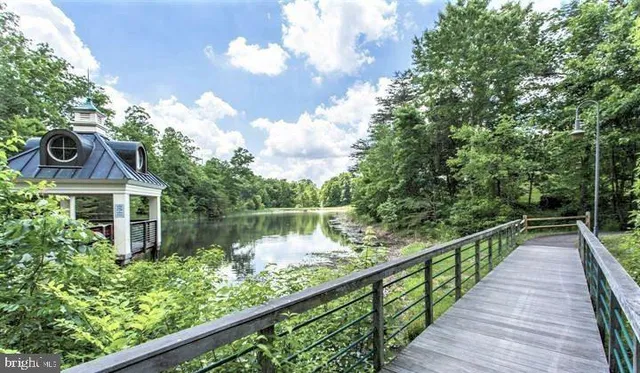a view of house with a yard