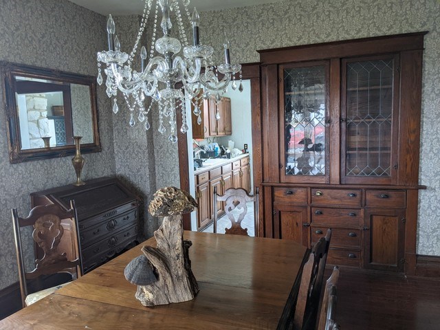231 State Line Road South Beloit, IL 61080 - Photo 10 of 19 a view of a dining room with furniture and chandelier