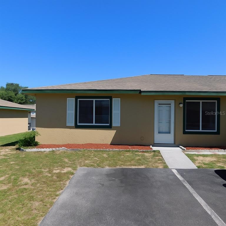 a house with yard in front of it