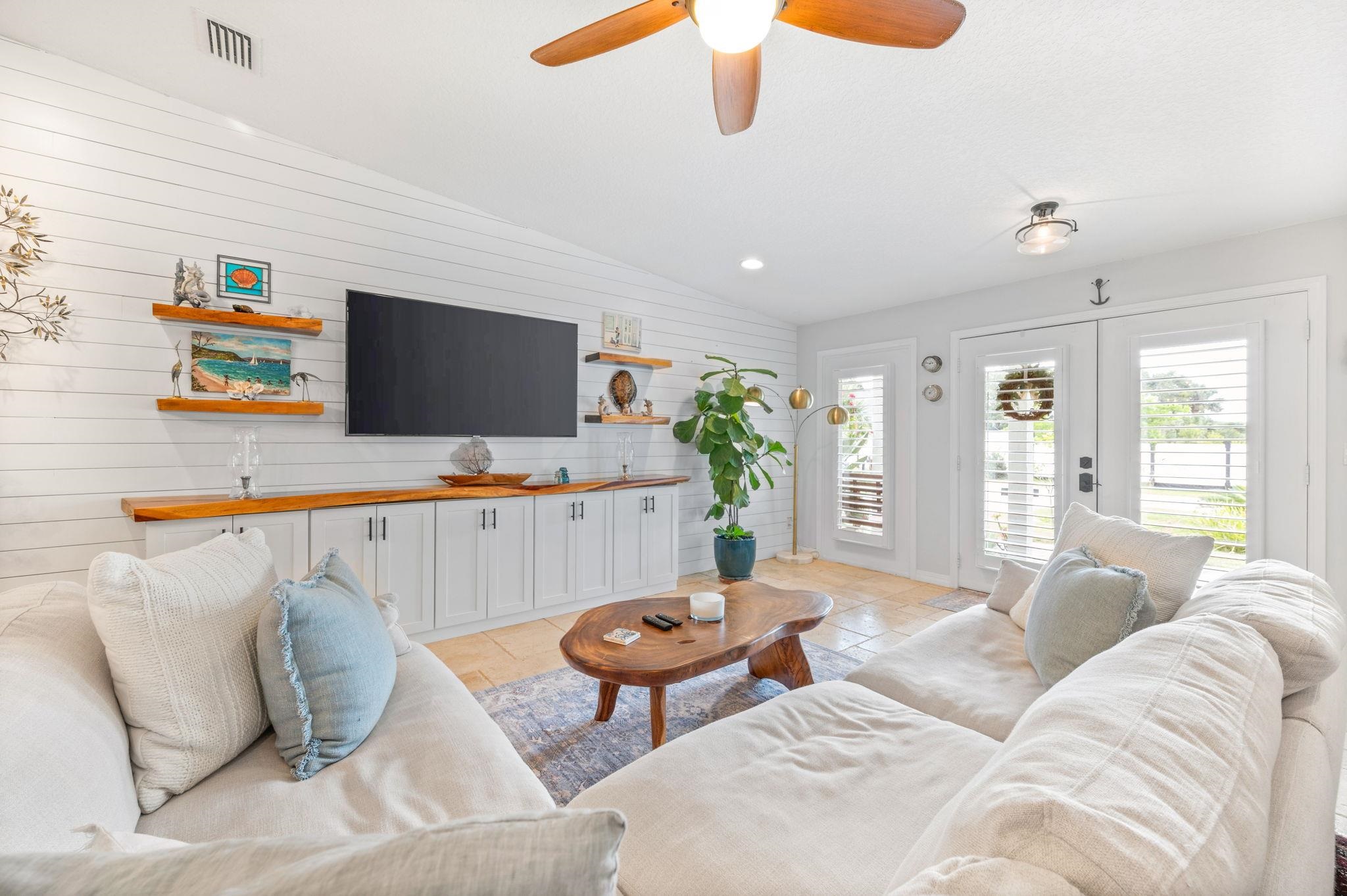 305 Mystical Way St. Augustine, FL 32080 - Photo 14 of 96 a living room with furniture and a flat screen tv
