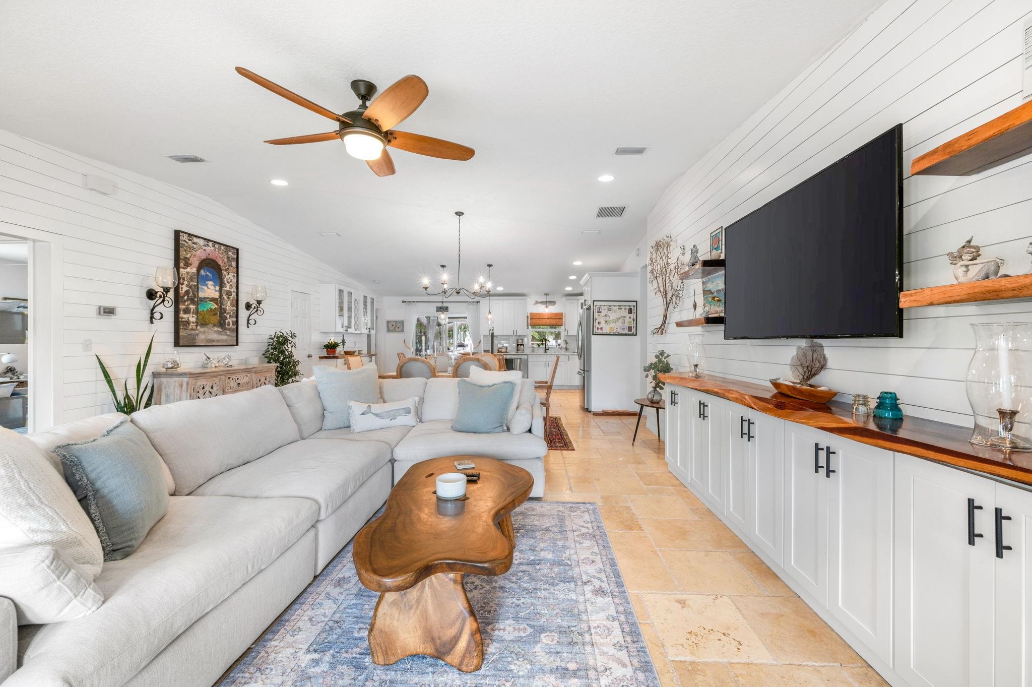 305 Mystical Way St. Augustine, FL 32080 - Photo 15 of 96 a living room with furniture kitchen view and a flat screen tv