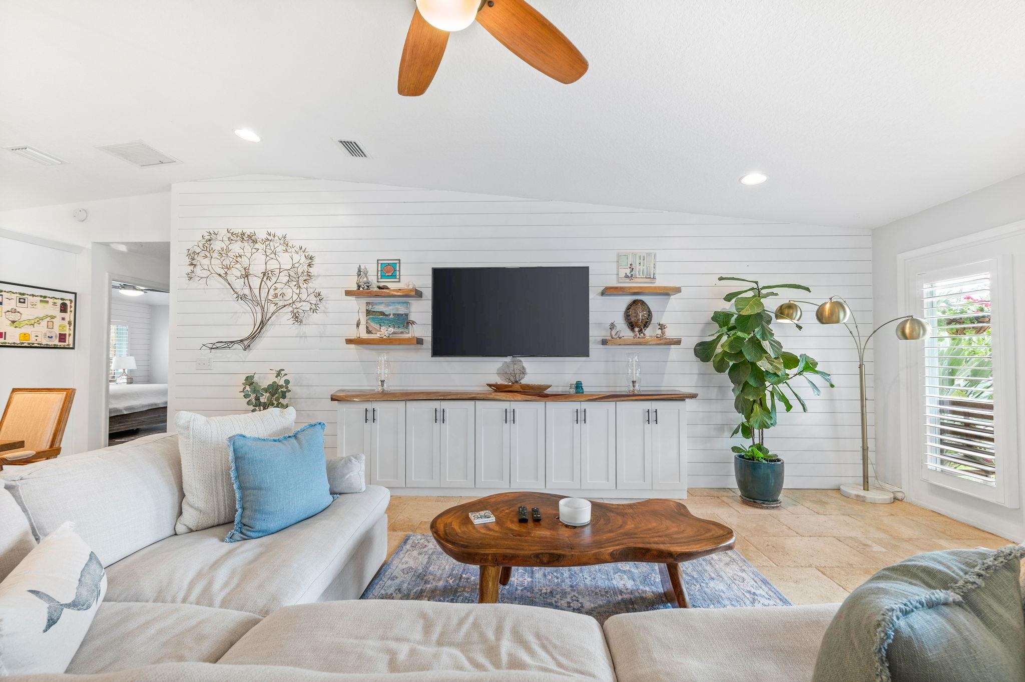 305 Mystical Way St. Augustine, FL 32080 - Photo 16 of 96 a living room with furniture and a flat screen tv