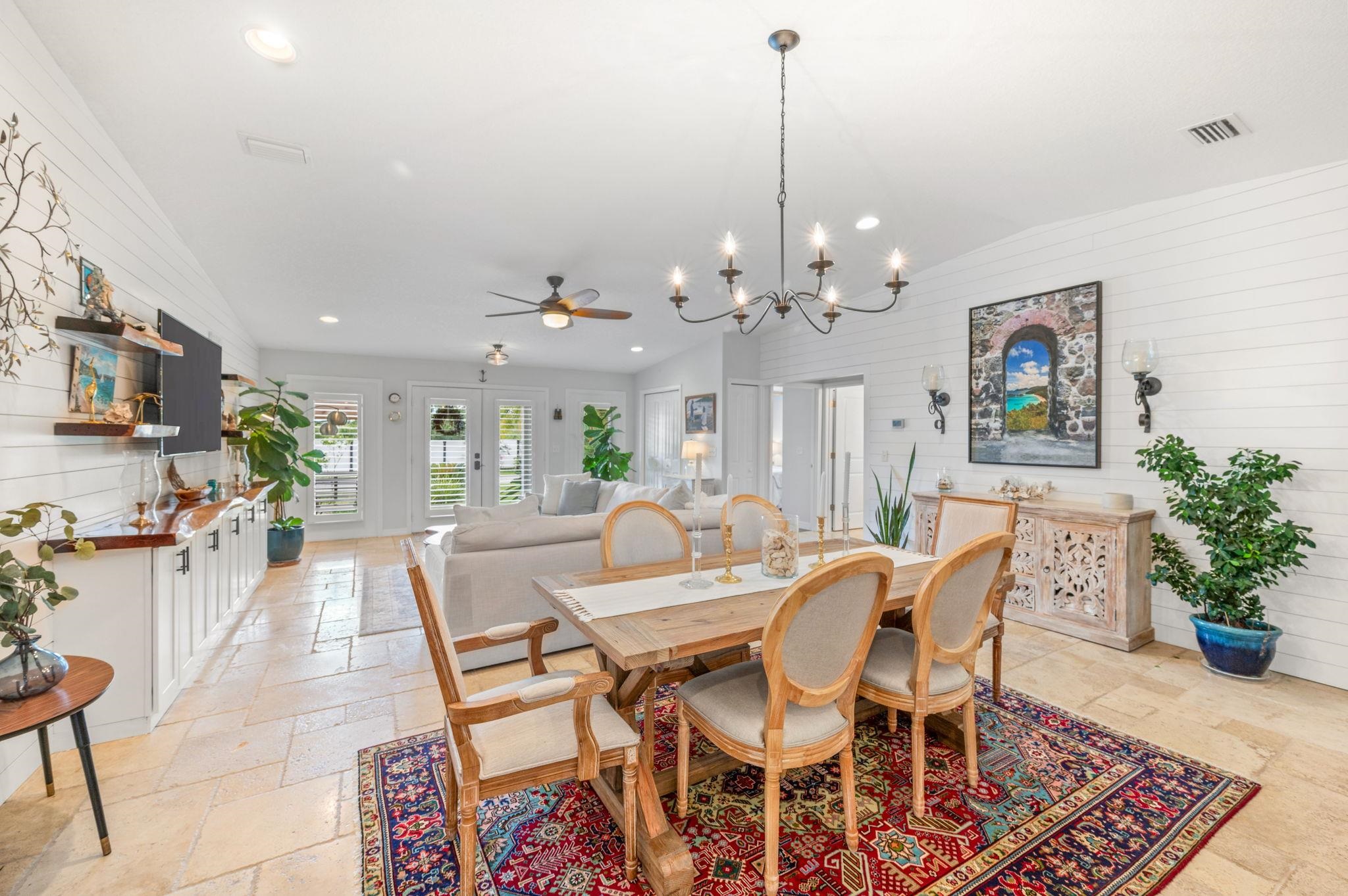 305 Mystical Way St. Augustine, FL 32080 - Photo 20 of 96 a view of a dining room with furniture and wooden floor