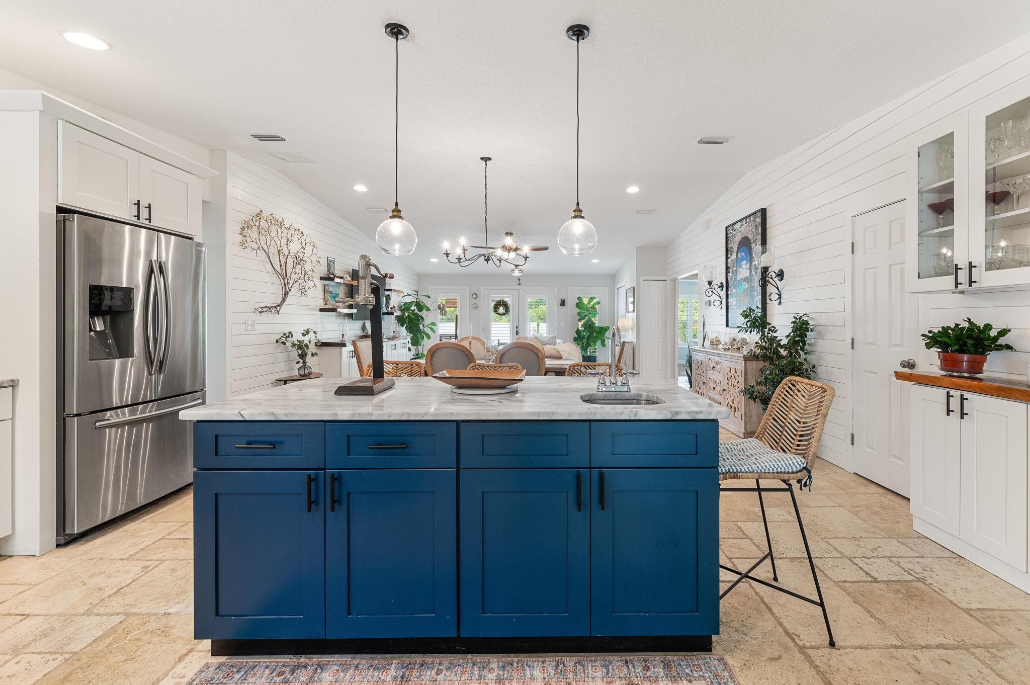 305 Mystical Way St. Augustine, FL 32080 - Photo 30 of 96 a kitchen with kitchen island a counter space a sink appliances and cabinets