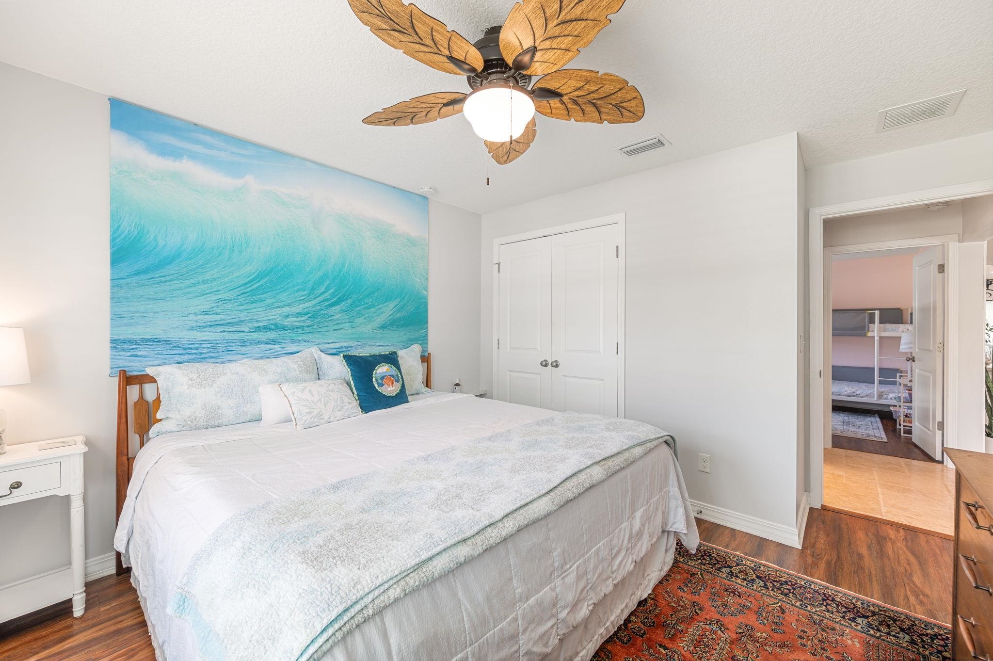 305 Mystical Way St. Augustine, FL 32080 - Photo 39 of 96 a bedroom with a bed and a chandelier