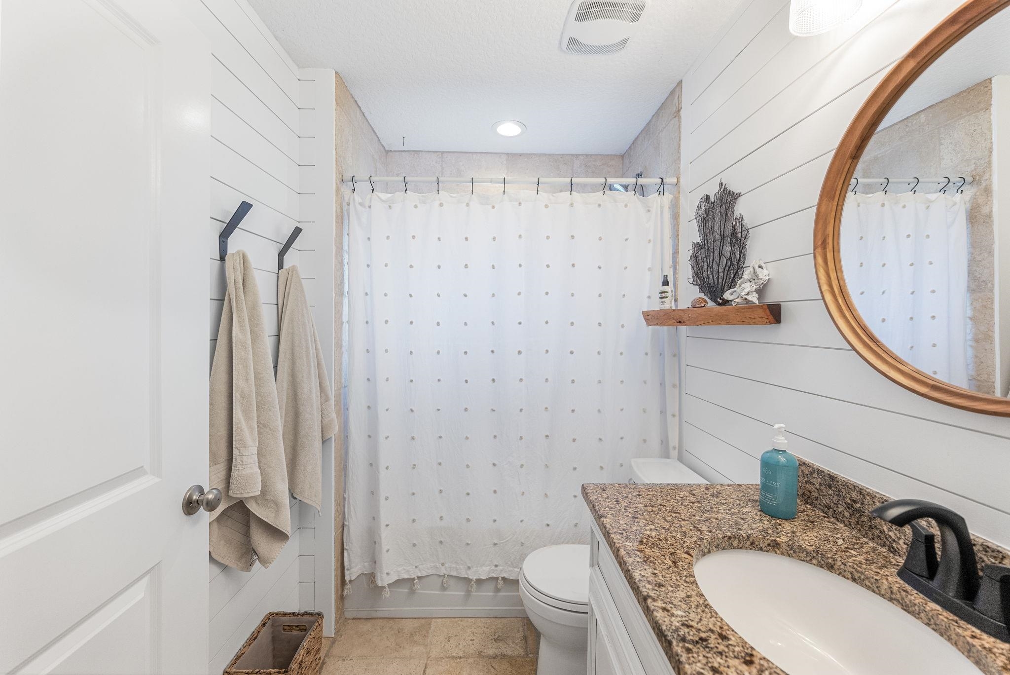 305 Mystical Way St. Augustine, FL 32080 - Photo 42 of 96 a bathroom with a granite countertop sink toilet and shower