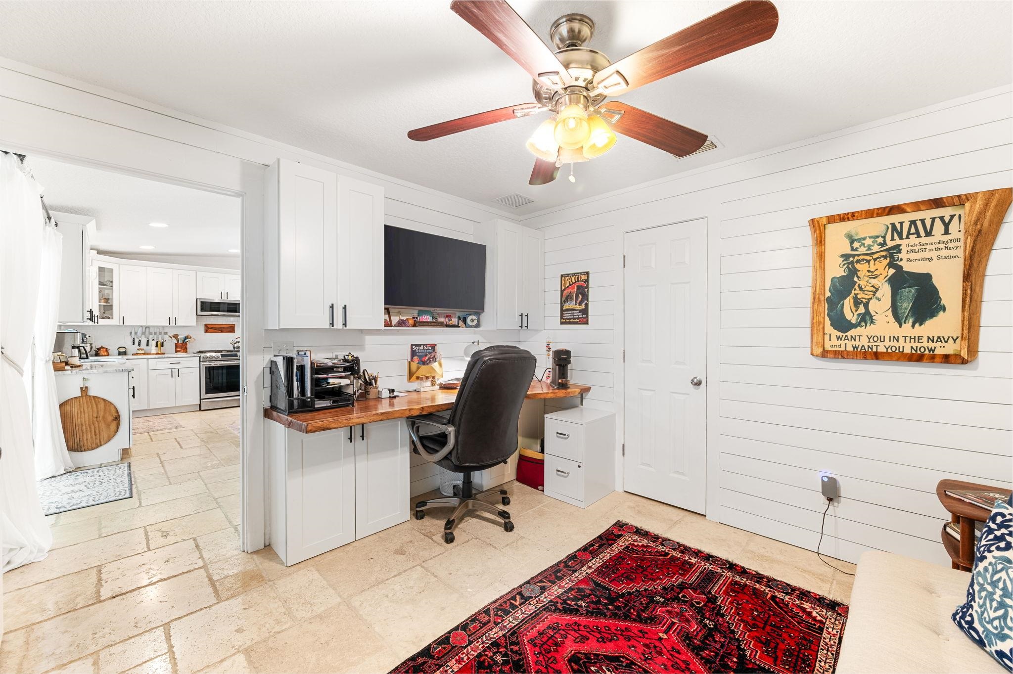 305 Mystical Way St. Augustine, FL 32080 - Photo 44 of 96 a view of a workspace with furniture and a ceiling fan