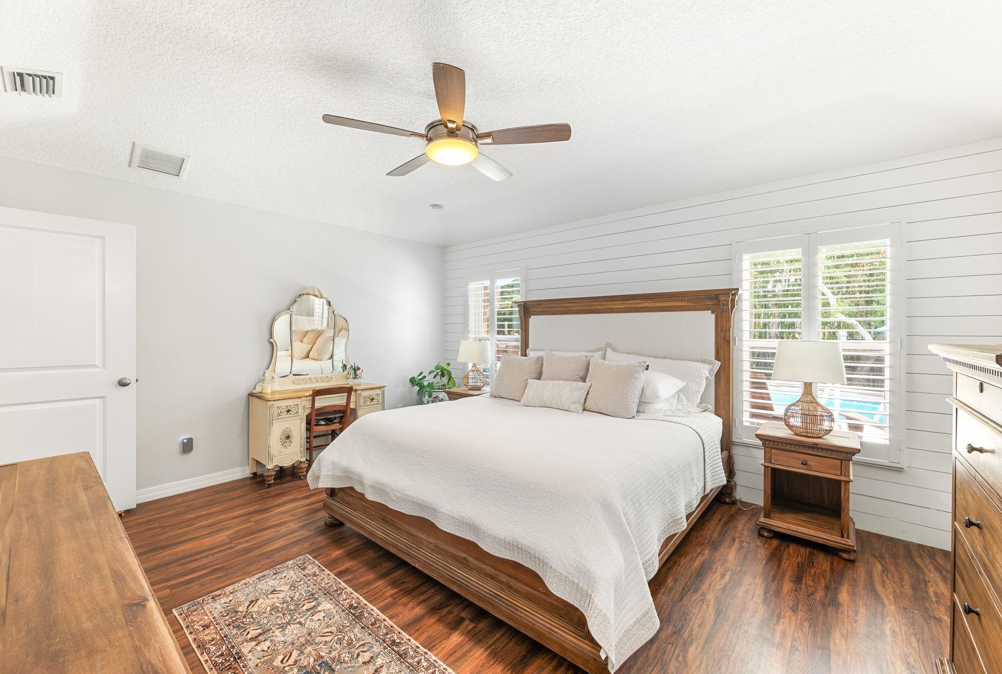 305 Mystical Way St. Augustine, FL 32080 - Photo 47 of 96 a bedroom with a bed and wooden floor