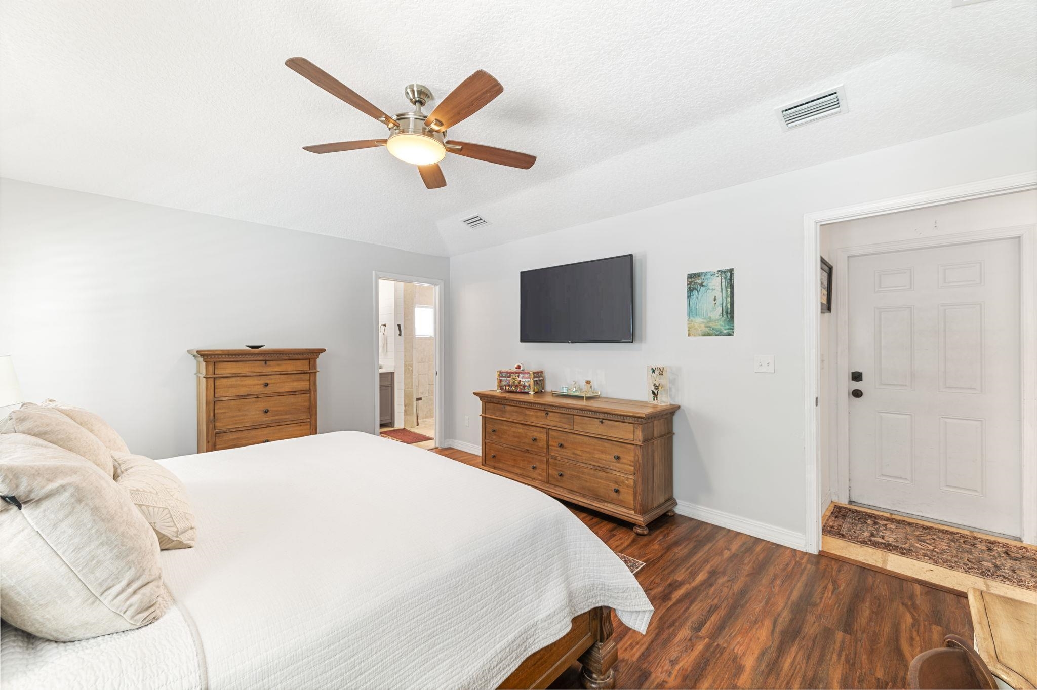 305 Mystical Way St. Augustine, FL 32080 - Photo 49 of 96 a bedroom with a bed and a flat screen tv