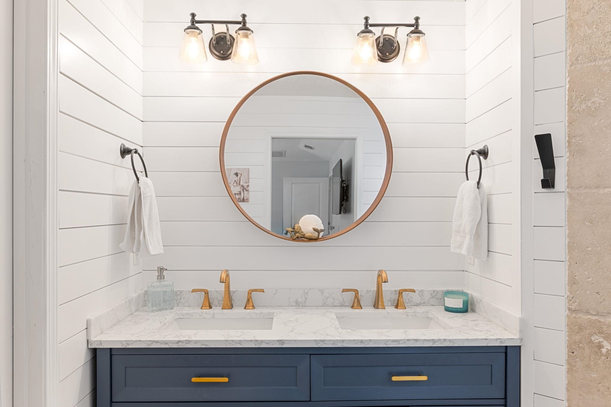 305 Mystical Way St. Augustine, FL 32080 - Photo 51 of 96 a bathroom with a sink and a mirror