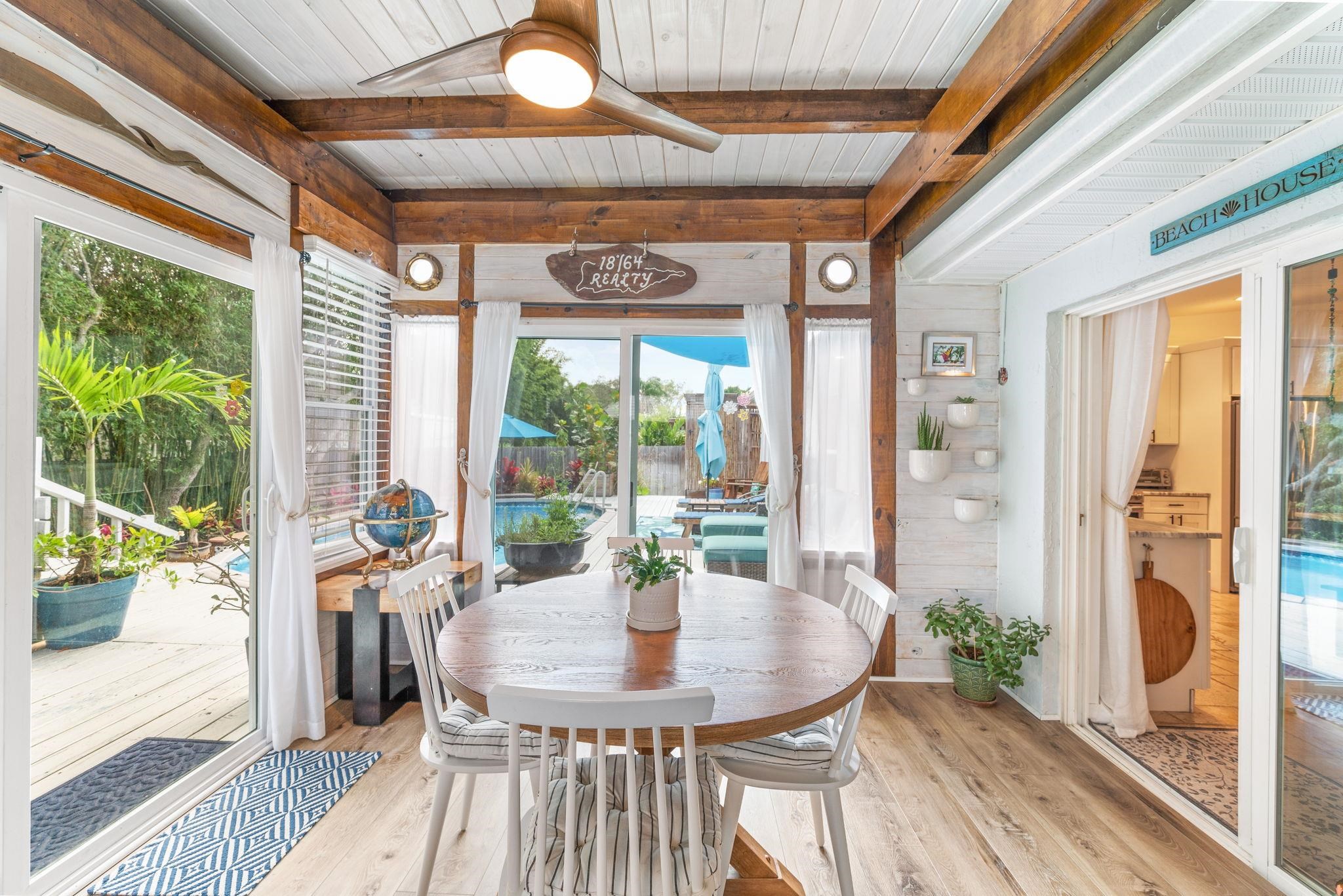 305 Mystical Way St. Augustine, FL 32080 - Photo 65 of 96 a view of a dining room with furniture window and outside view
