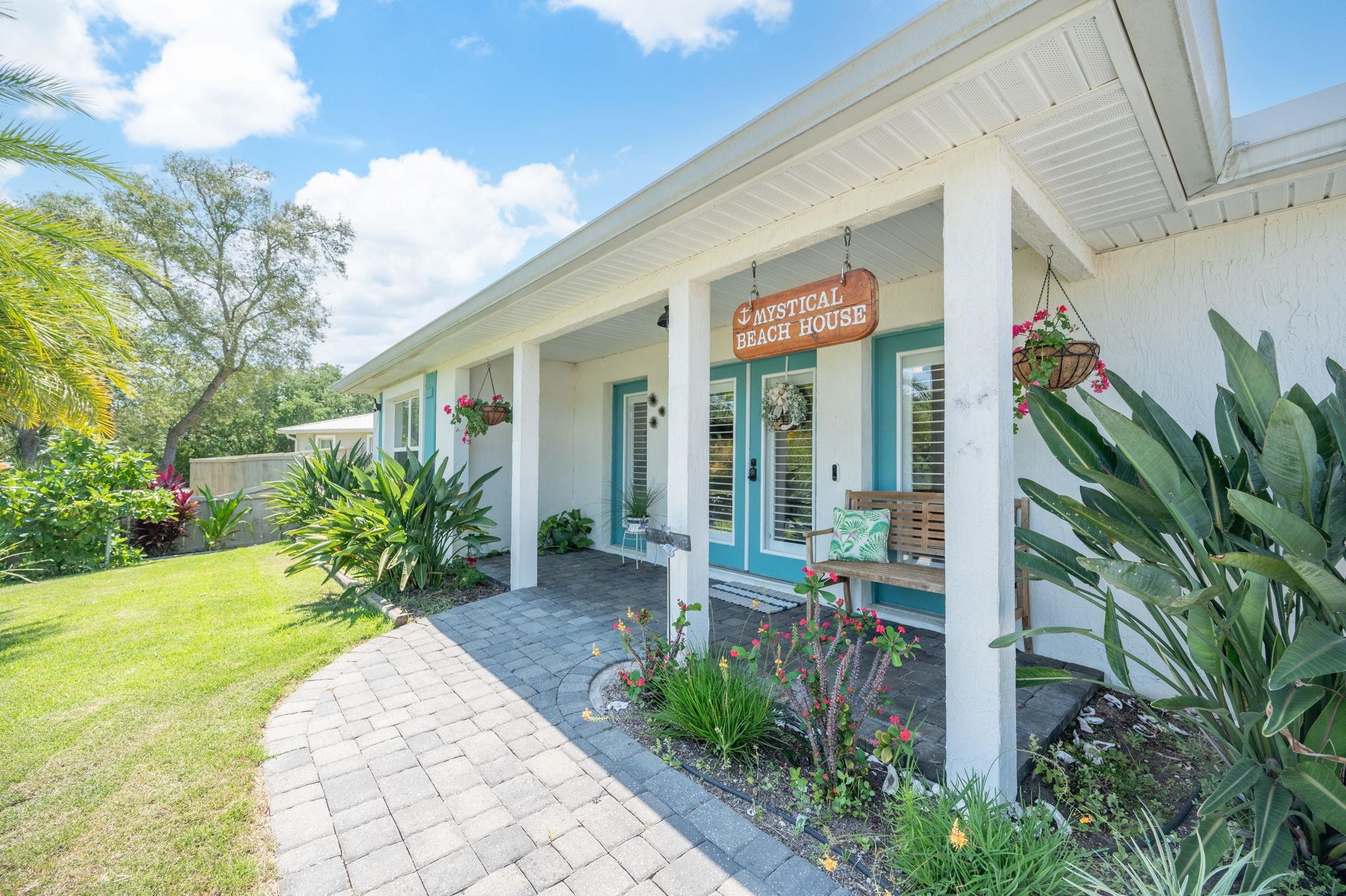 305 Mystical Way St. Augustine, FL 32080 - Photo 7 of 96 a front view of a house with a porch