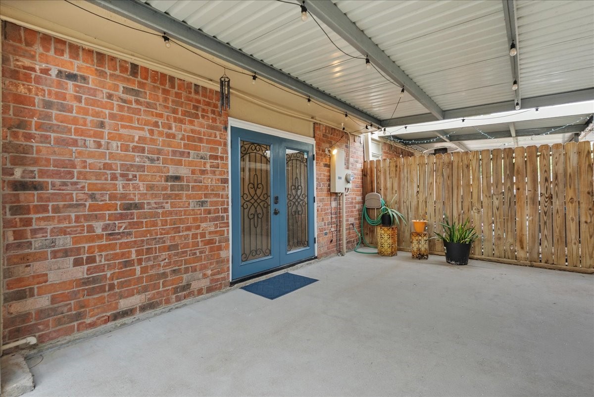 1572 Silverpines Road, Unit 572 Houston, TX 77062 - Photo 26 of 37 The beautiful French doors lead from the covered patio into the kitchen/dining area. This is a great way to enjoy indoor-outdoor living.