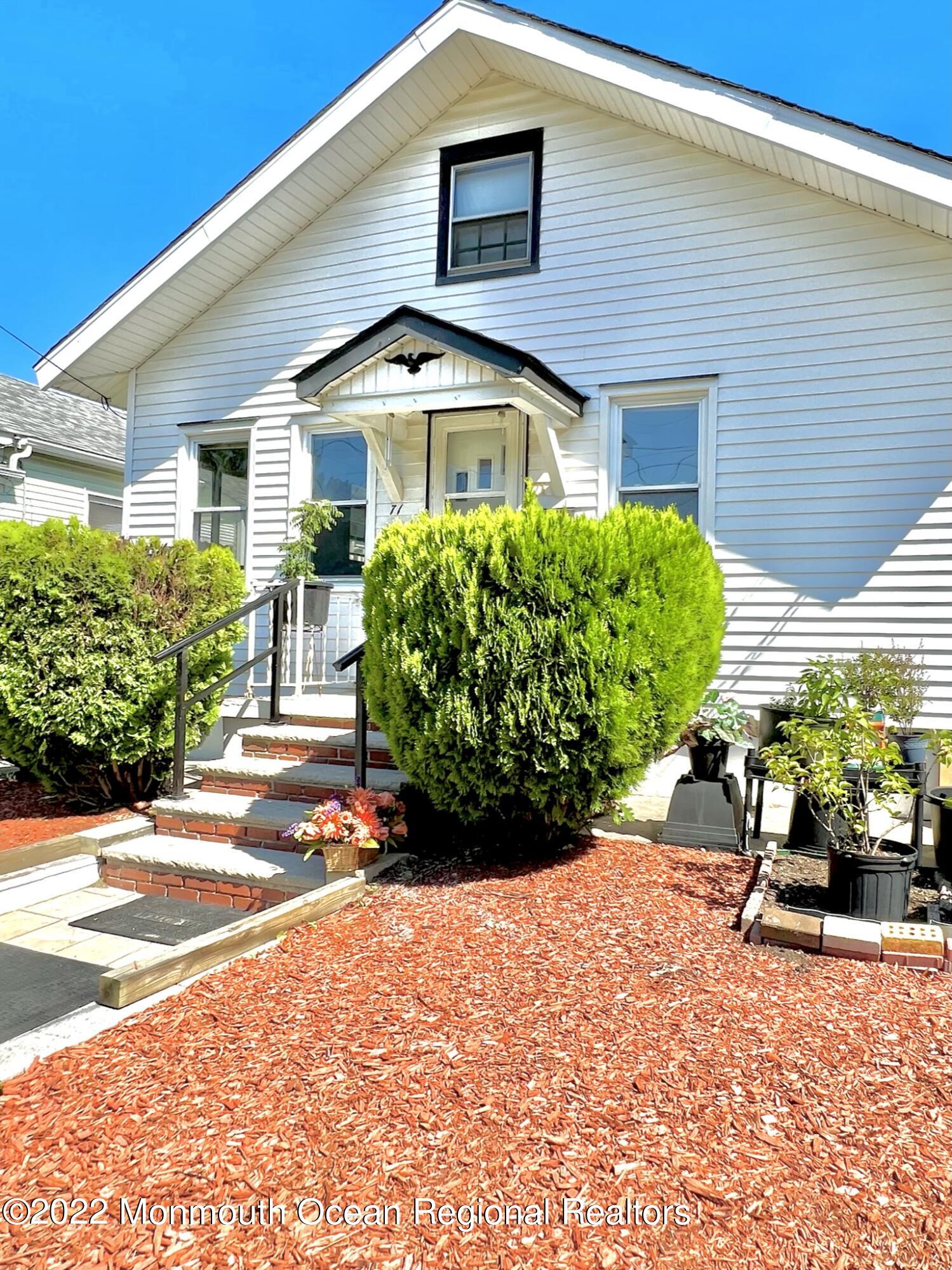 71 White Road Shrewsbury, NJ 07702 - Photo 2 of 26 a front view of a house with garden