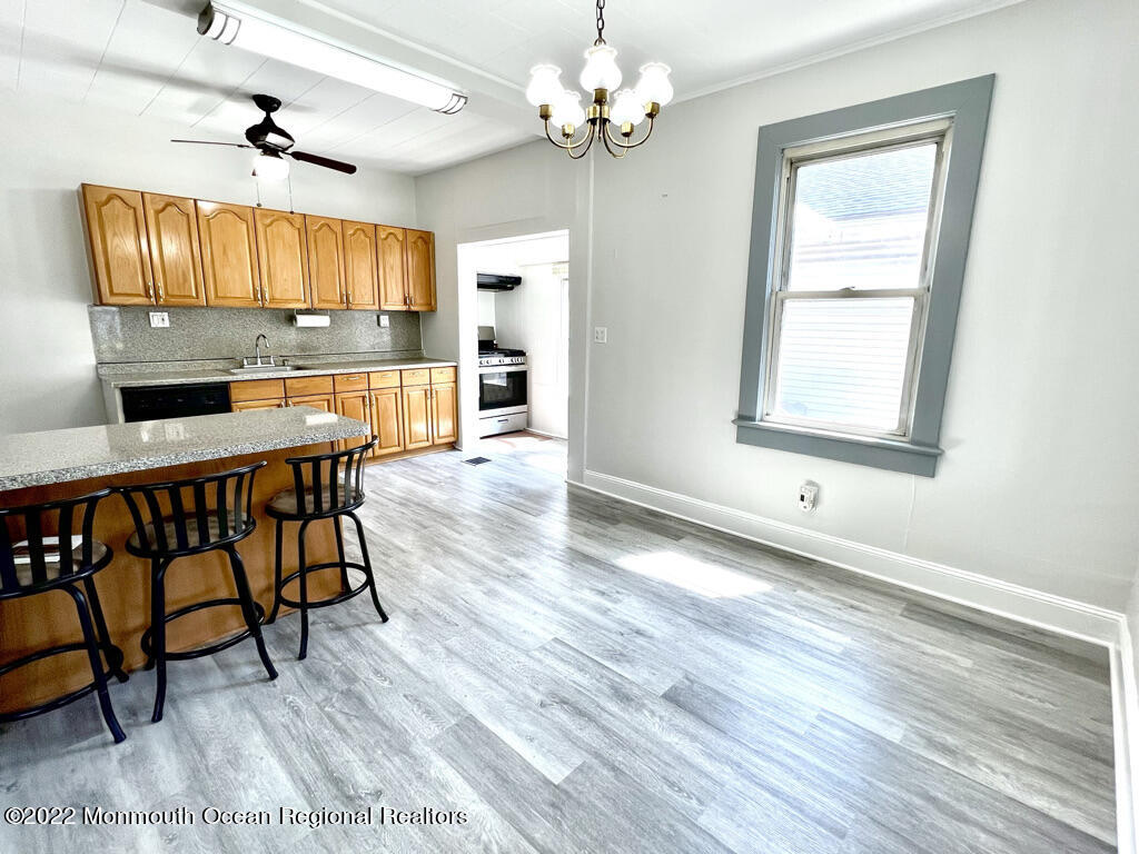 71 White Road Shrewsbury, NJ 07702 - Photo 7 of 26 a view of a livingroom with furniture window and wooden floor
