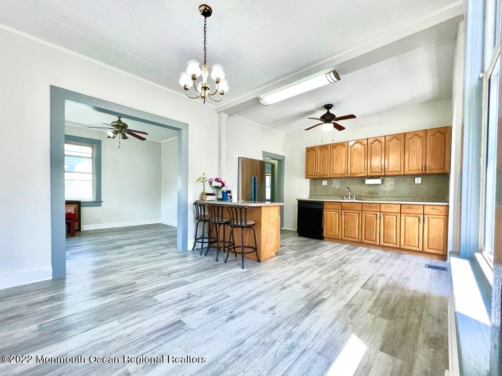 71 White Road Shrewsbury, NJ 07702 - Photo 8 of 26 a view of a kitchen with a sink and breakfast area