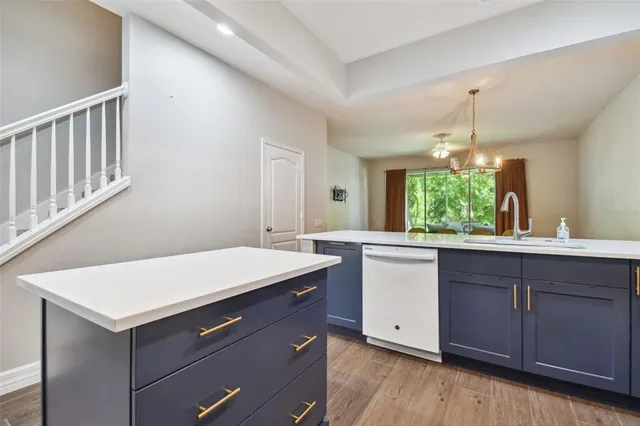 a view of a dining room with a table and chairs