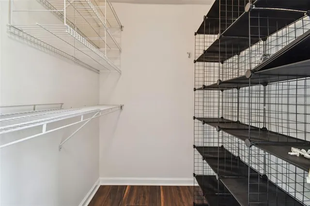 a bathroom with a granite countertop sink a large mirror and vanity