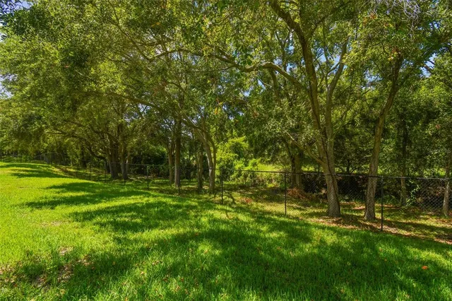 a aerial view of a house with a yard