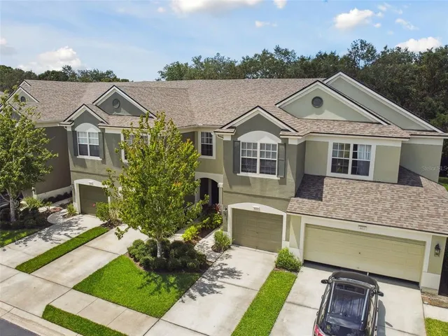 an aerial view of a city with a lake view