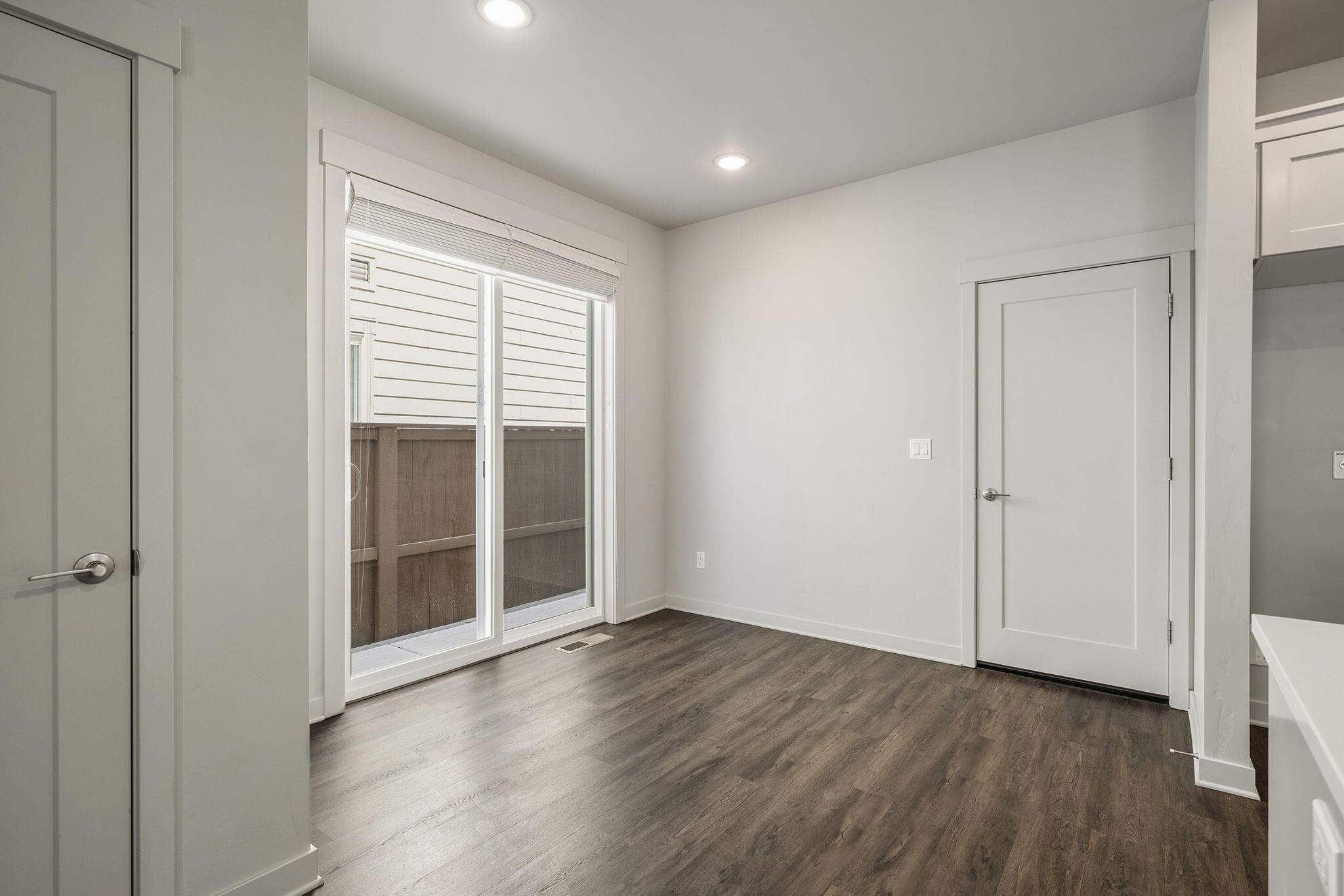 2366 Northeast Victor Place Bend, OR 97701 - Photo 10 of 31 an empty room with wooden floor and windows