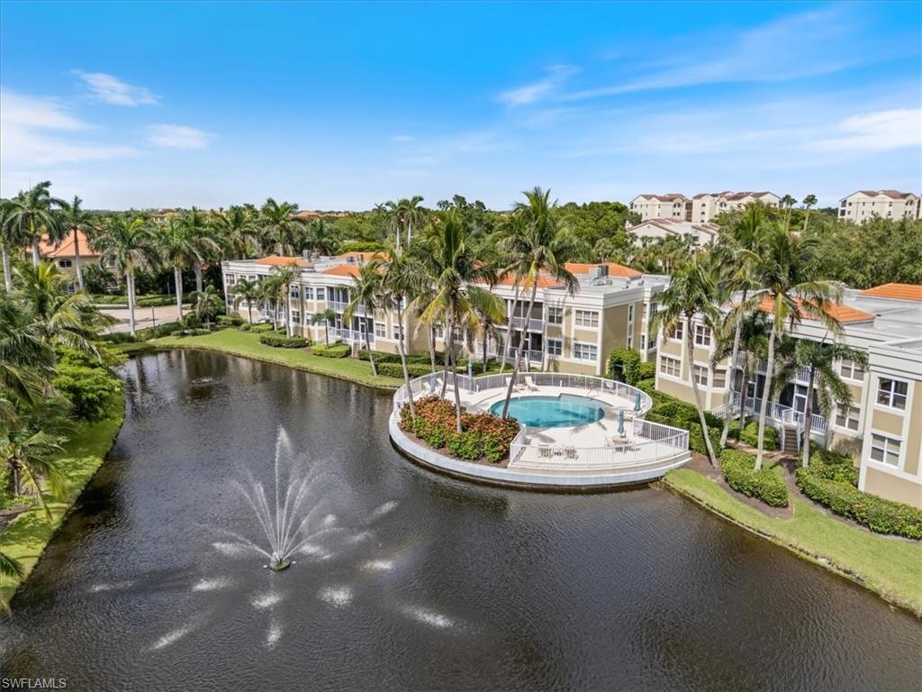 6549 Marissa Loop, Unit 15 Naples, FL 34108 - Photo 16 of 24 a view of a lake with a terrace
