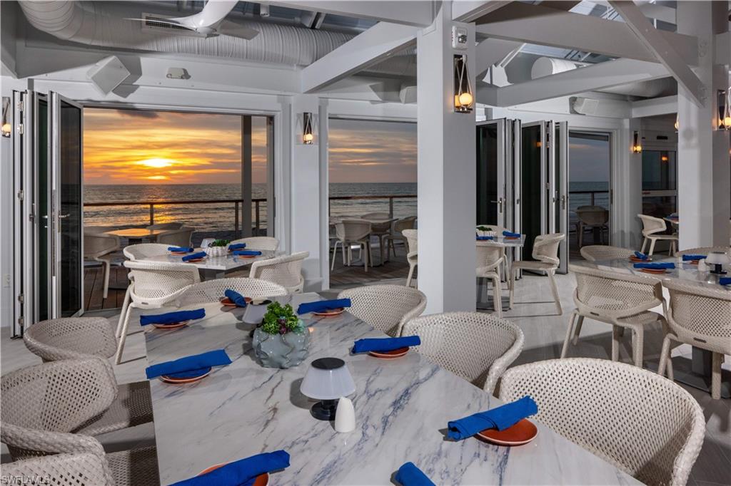 6549 Marissa Loop, Unit 15 Naples, FL 34108 - Photo 20 of 24 a outdoor living space with furniture and a flat screen tv