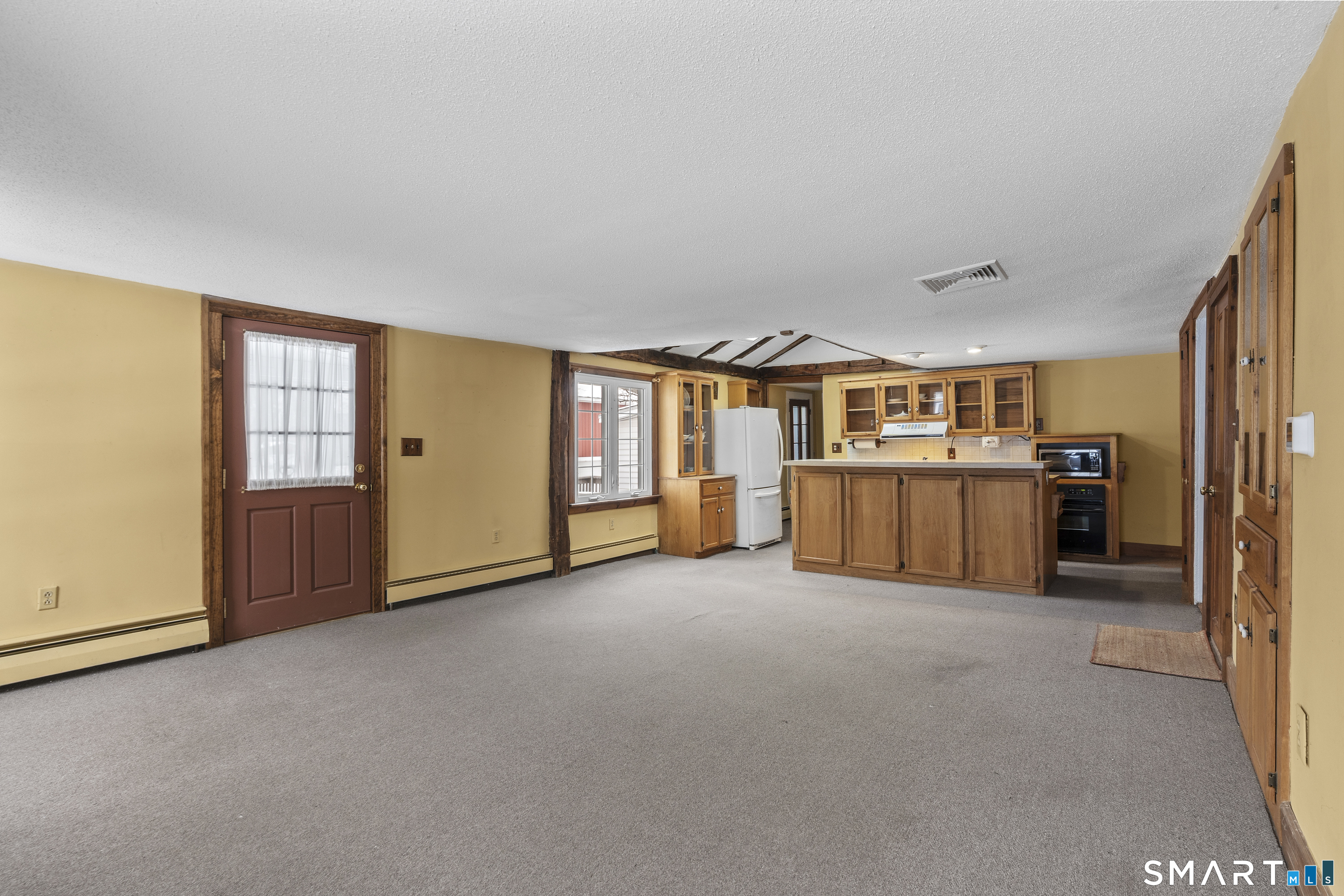 392 Boston Neck Road Suffield, CT 06078 - Photo 7 of 35 Great open concept kitchen /living room space holds many possibilities.