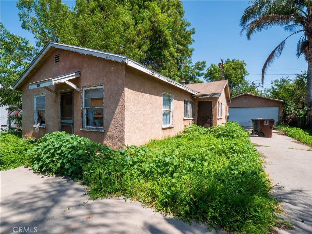 220 South Harris Avenue Compton, CA 90221 - Photo 15 of 18 a front view of a house with a yard