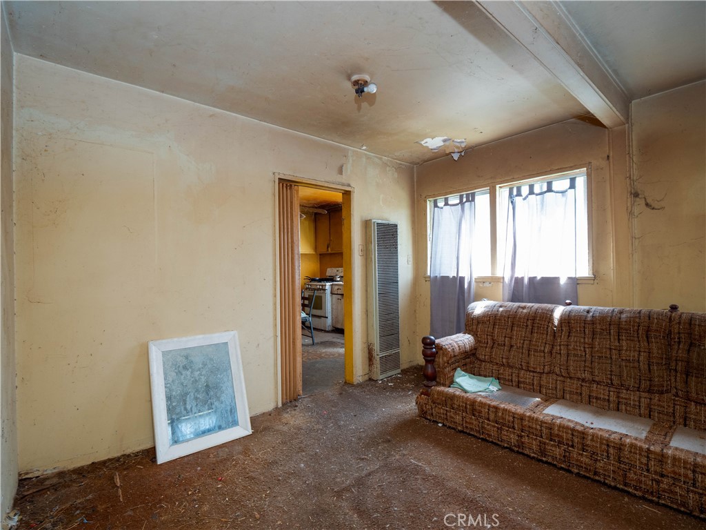 220 South Harris Avenue Compton, CA 90221 - Photo 4 of 18 a living room with furniture and a window
