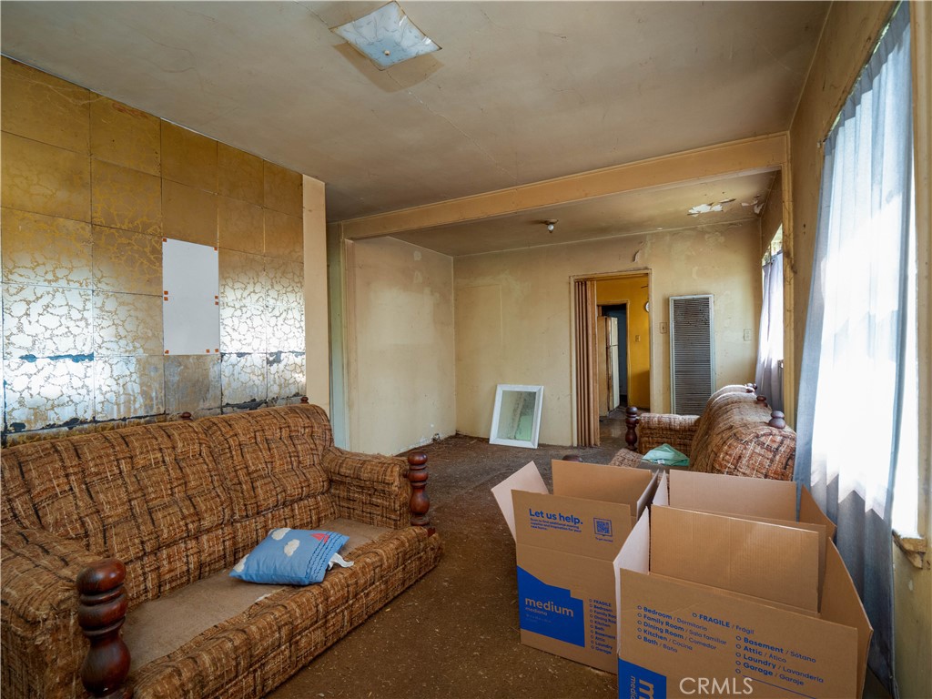 220 South Harris Avenue Compton, CA 90221 - Photo 6 of 18 a living room with furniture and a potted plant