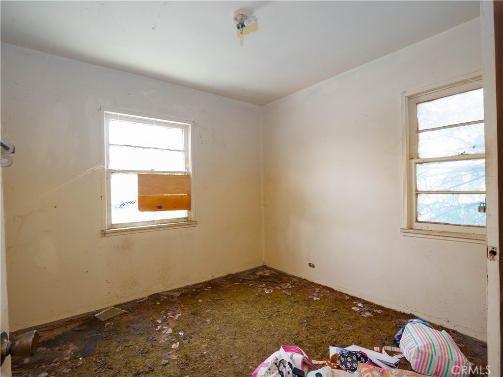 220 South Harris Avenue Compton, CA 90221 - Photo 7 of 18 a room with a bed and a window