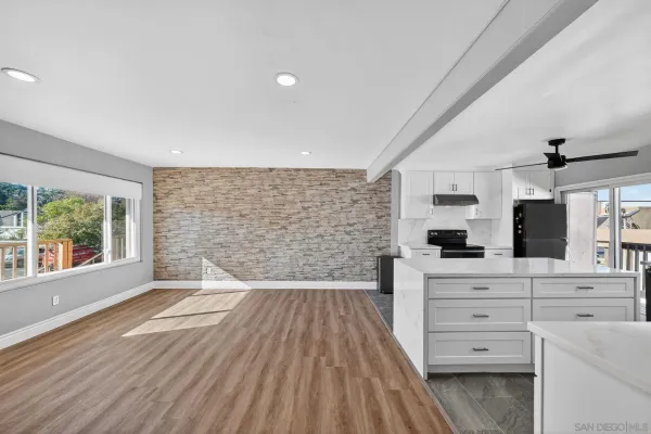 a view of kitchen and wooden floor