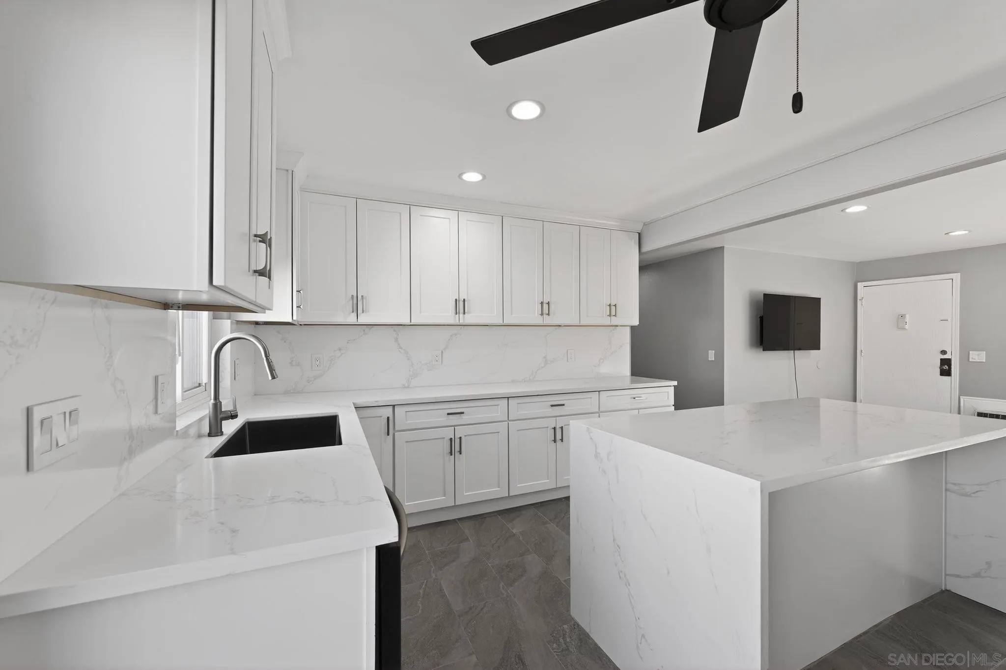 879 Jamacha Road El Cajon, CA 92019 - Photo 13 of 32 a kitchen with sink a microwave and cabinets