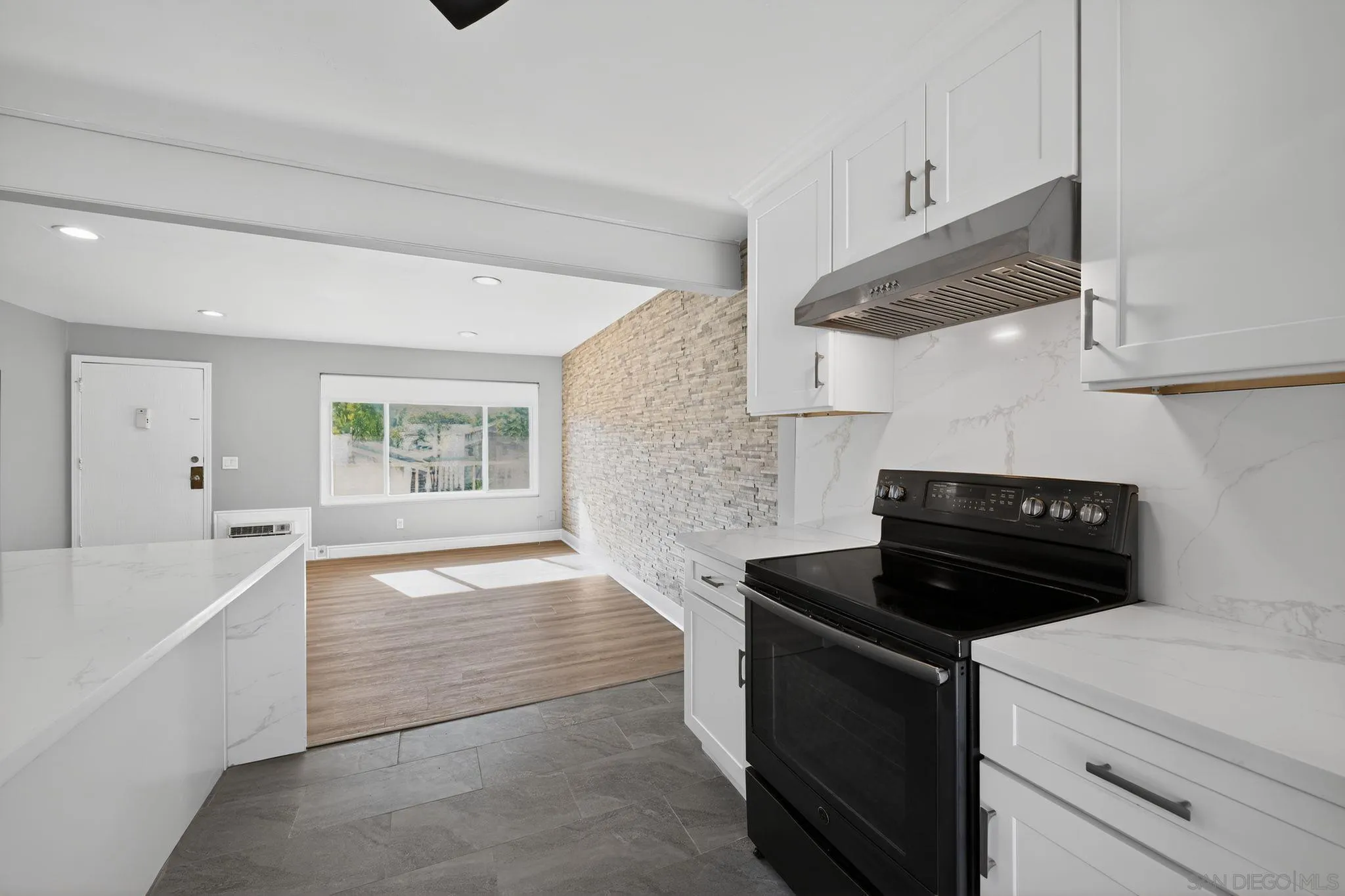 879 Jamacha Road El Cajon, CA 92019 - Photo 16 of 32 a kitchen with a stove and a refrigerator