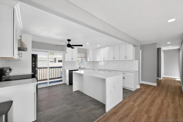 a kitchen with appliances cabinets and a sink