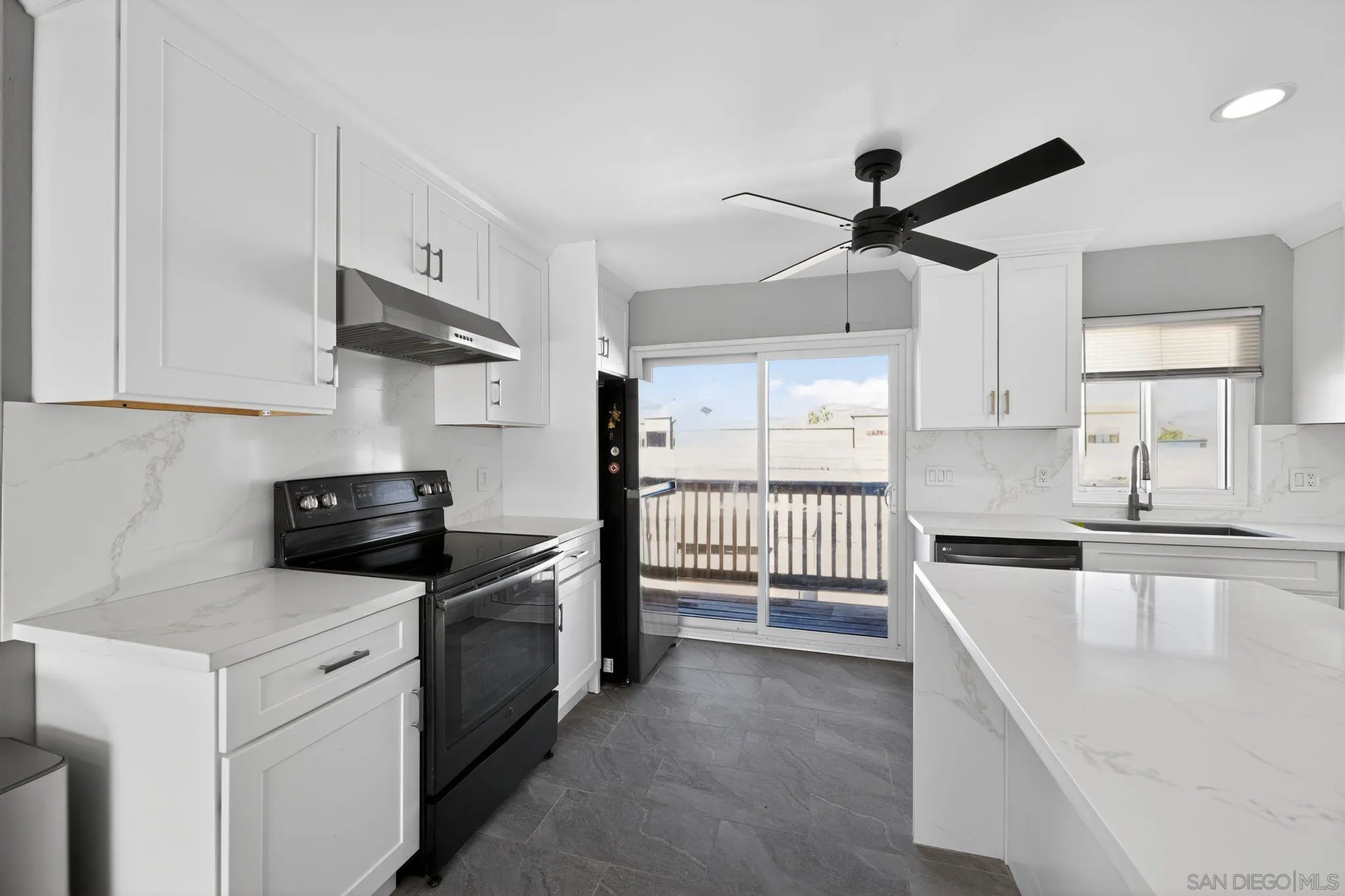 879 Jamacha Road El Cajon, CA 92019 - Photo 20 of 32 a kitchen with stainless steel appliances granite countertop a sink and a stove