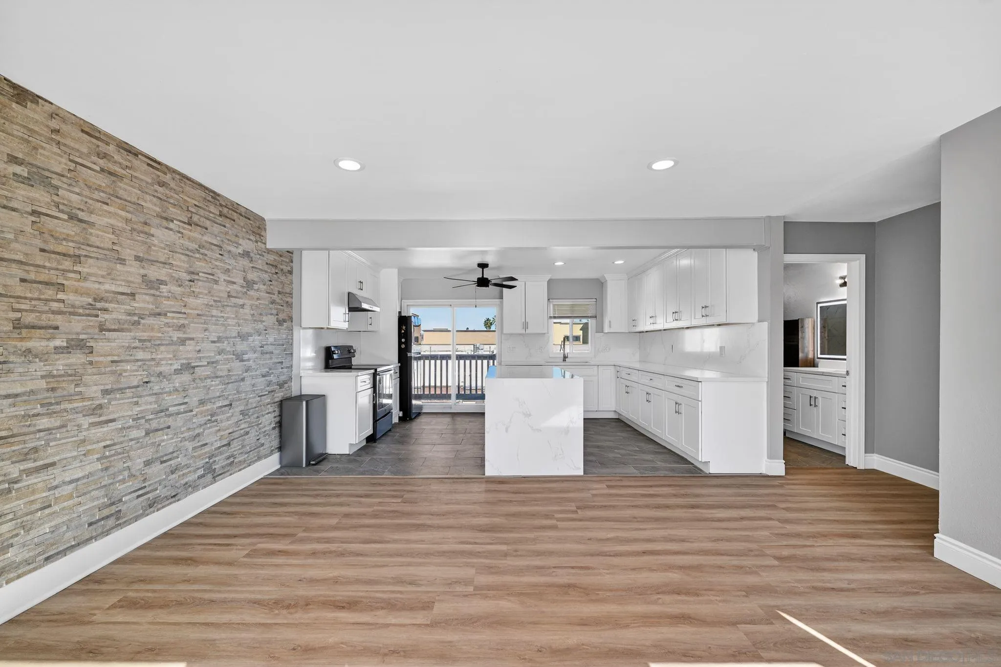 879 Jamacha Road El Cajon, CA 92019 - Photo 21 of 32 a living room with stainless steel appliances kitchen island granite countertop a refrigerator and a stove top oven