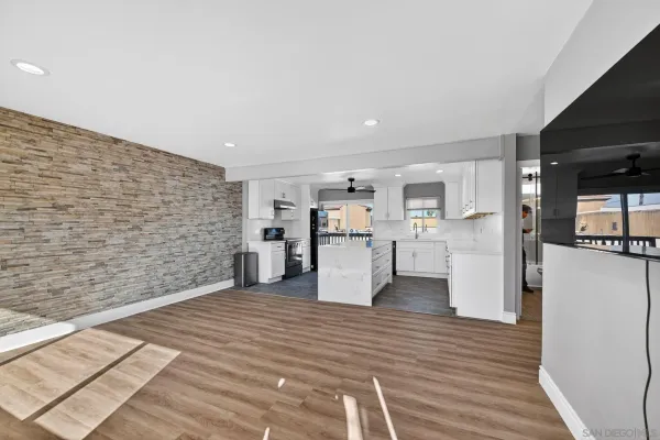 a view of a kitchen with wooden floor