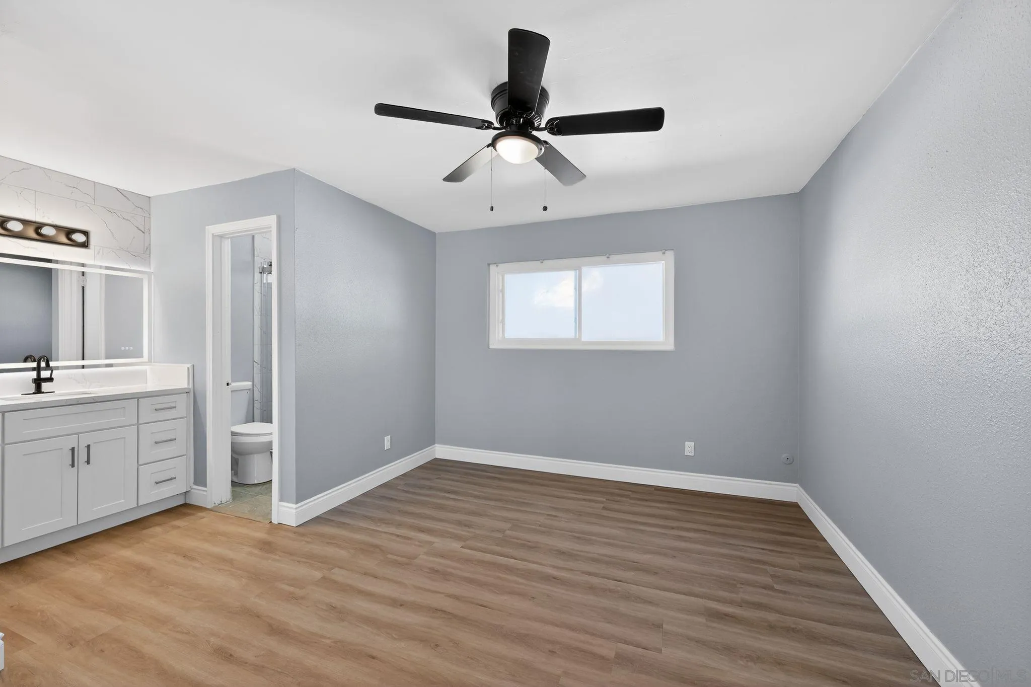 879 Jamacha Road El Cajon, CA 92019 - Photo 26 of 32 wooden floor in an empty room with a window