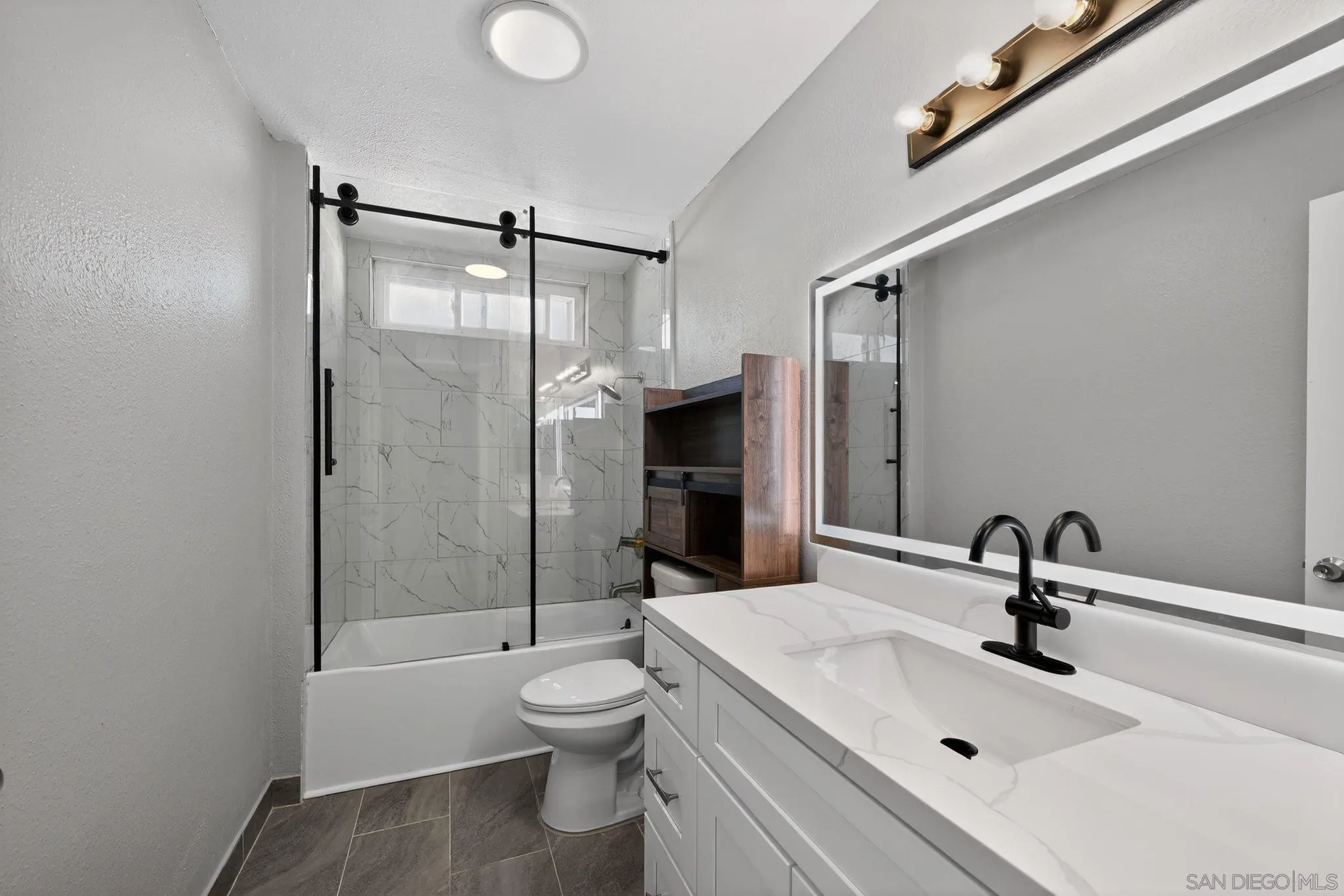 879 Jamacha Road El Cajon, CA 92019 - Photo 29 of 32 a bathroom with a sink toilet and shower