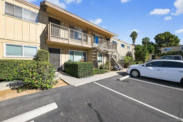 a view of a car parked in front of a building