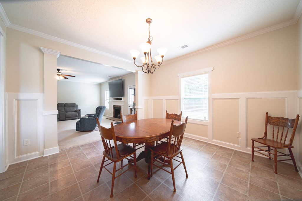 305 Owens Road Fort Mitchell, AL 36856 - Photo 11 of 44 a view of a dining room with furniture and a chandelier