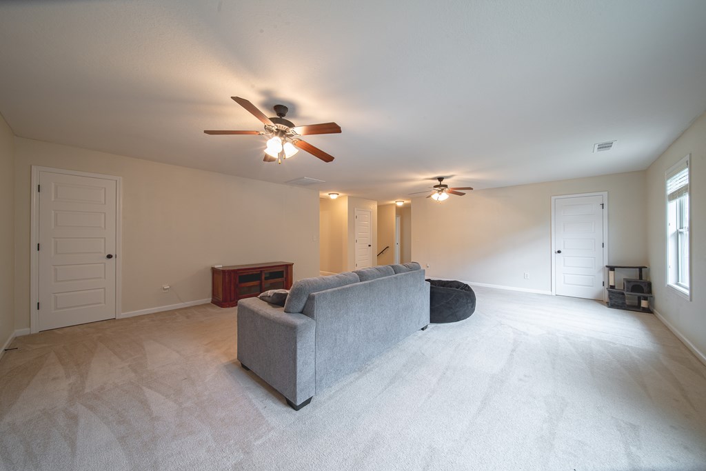 305 Owens Road Fort Mitchell, AL 36856 - Photo 33 of 44 a living room with furniture and a ceiling fan