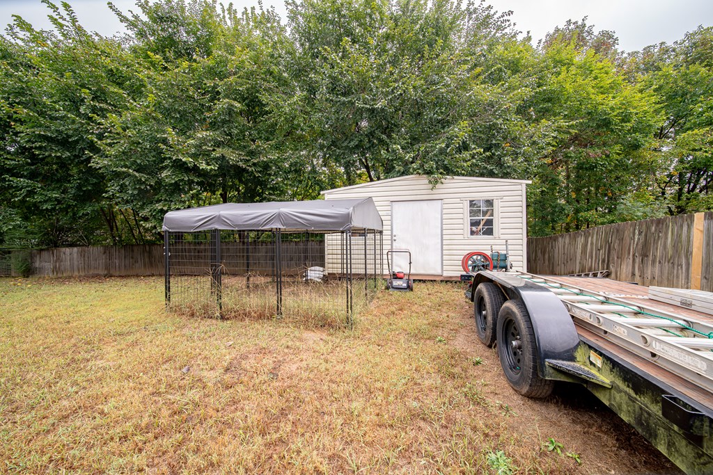 305 Owens Road Fort Mitchell, AL 36856 - Photo 41 of 44 a view of a house with backyard and sitting area