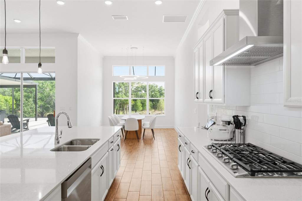 16071 Barkly Rdg Court Winter Garden, FL 34787 - Photo 15 of 31 a kitchen with stainless steel appliances granite countertop a sink stove and cabinets