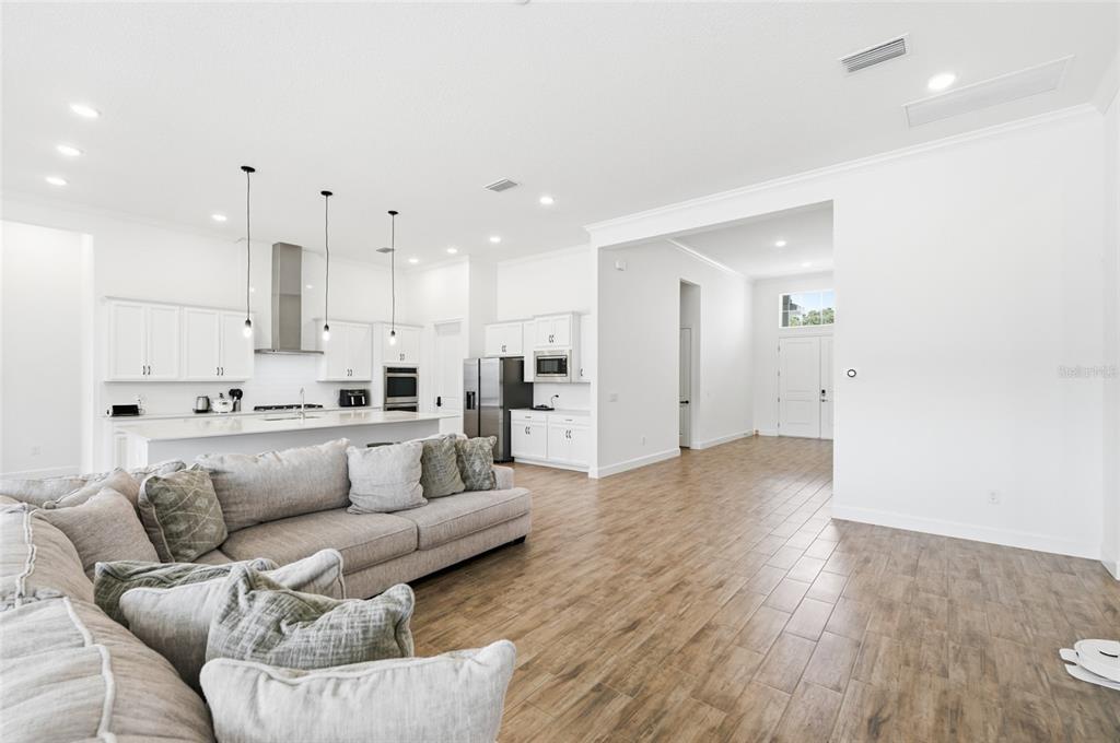 16071 Barkly Rdg Court Winter Garden, FL 34787 - Photo 20 of 31 a view of kitchen with kitchen island white cabinets and stainless steel appliances