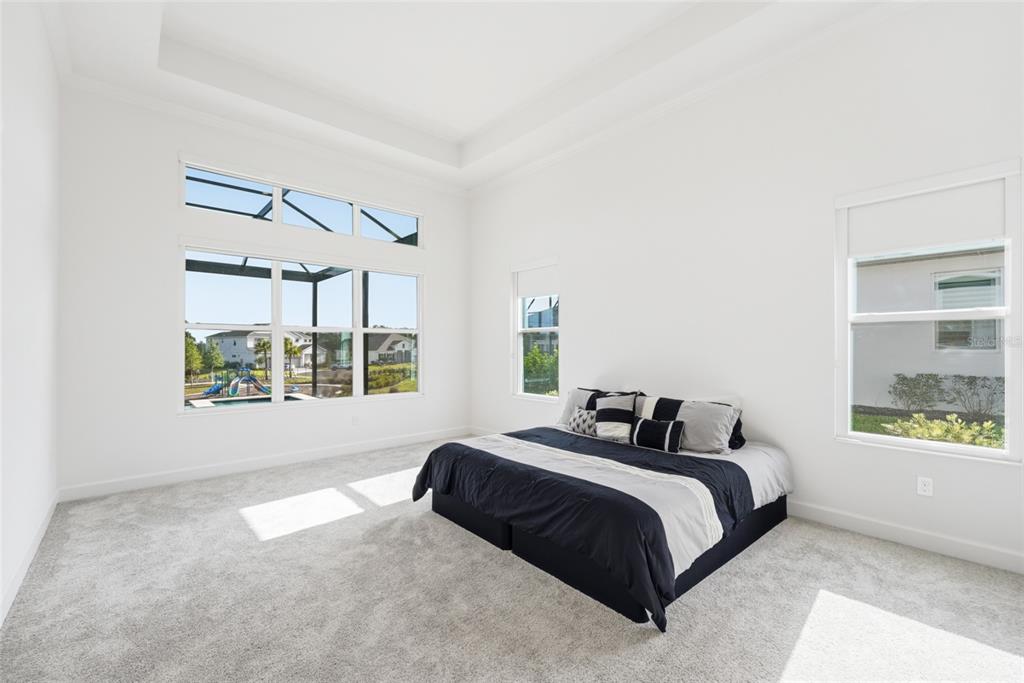 16071 Barkly Rdg Court Winter Garden, FL 34787 - Photo 26 of 31 a bedroom with a bed next to a window